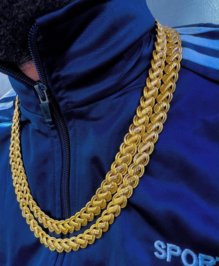 Gold foxtail chains worn as a lifestyle look