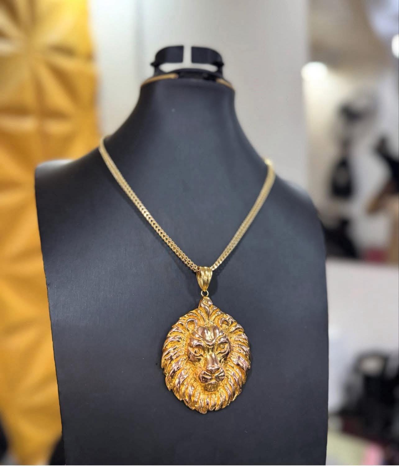 Custom gold lion head pendant by Baron Gold