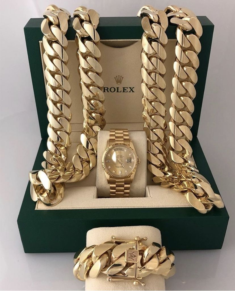 Gold Cuban chains and watch