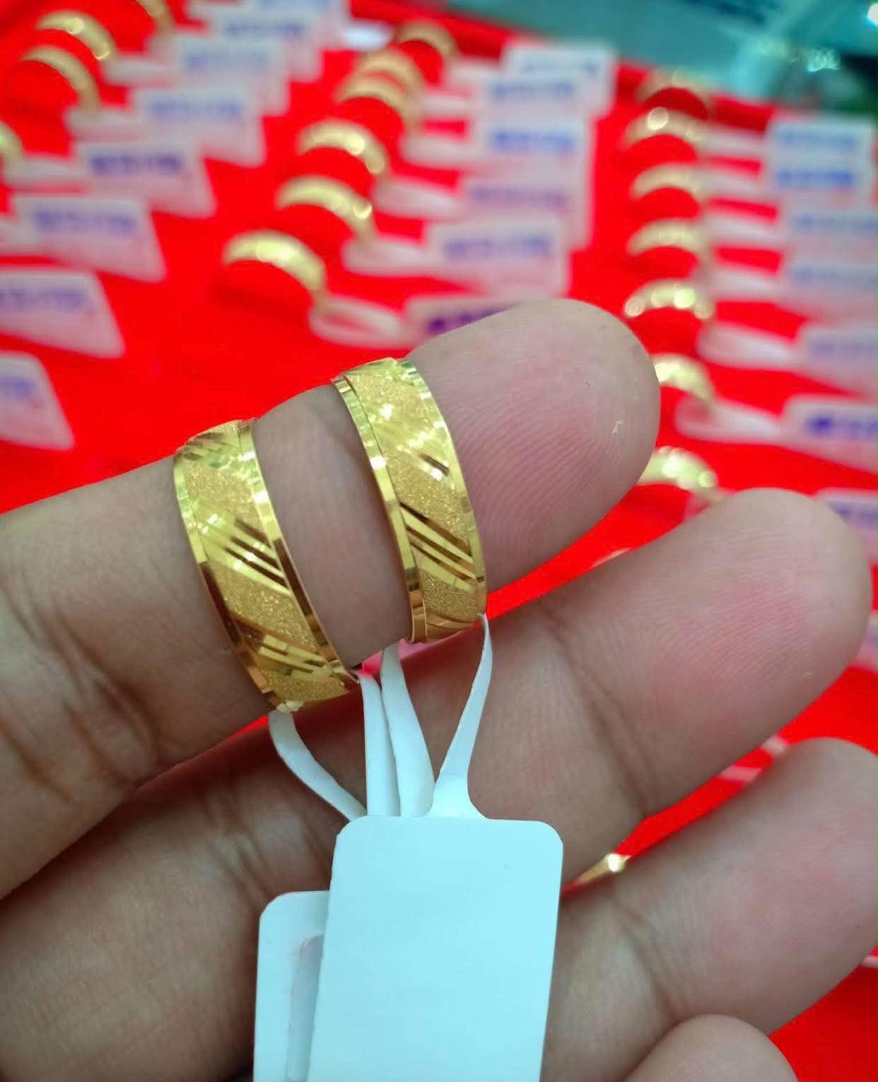 Gold wedding bands worn on hands